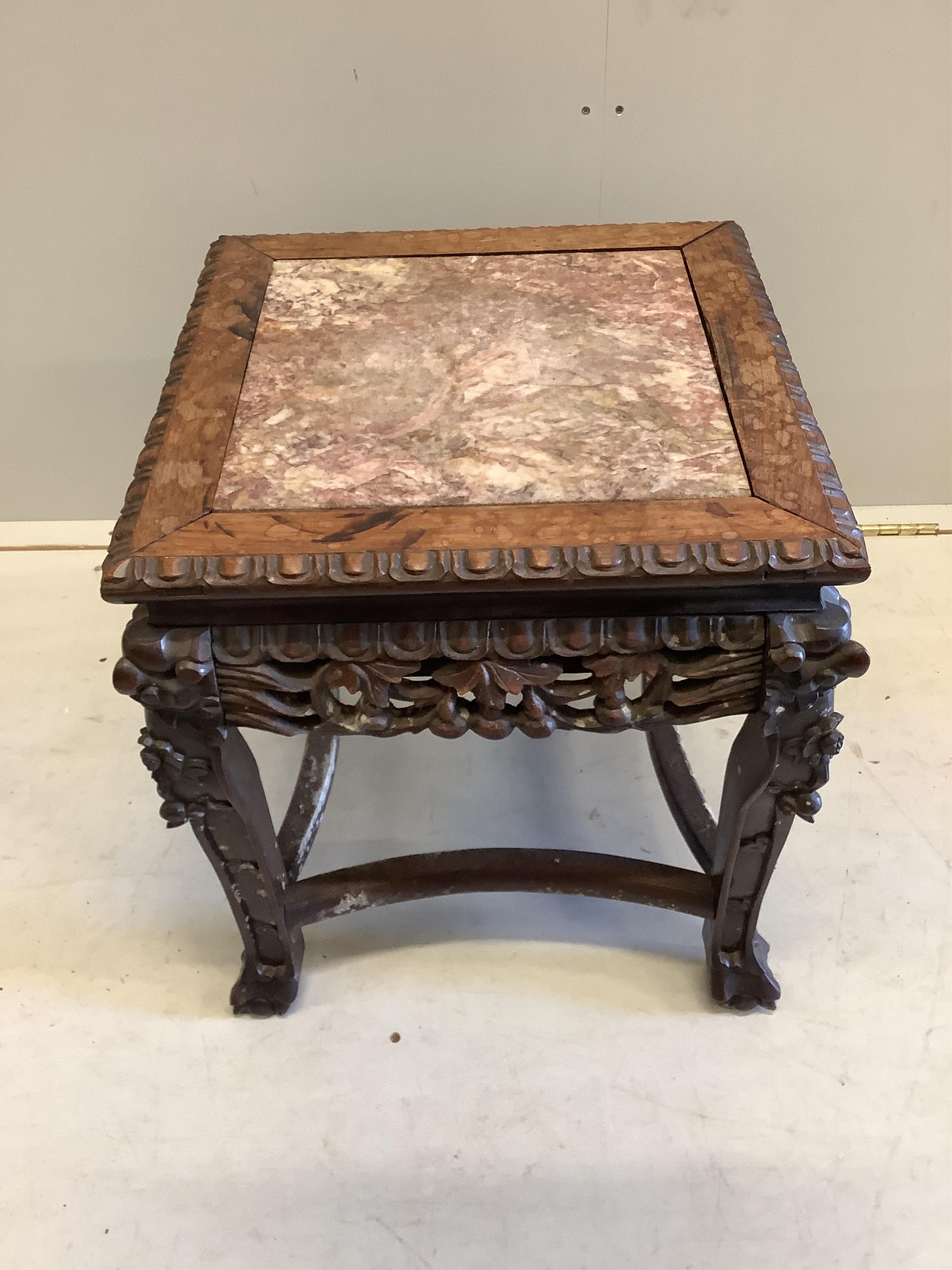 A late 19th century Chinese rouge marble topped hardwood vase stand, width 42cm, depth 42cm, height 46cm
